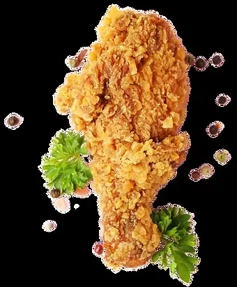 Crispy fried chicken piece with parsley and peppercorns on black.