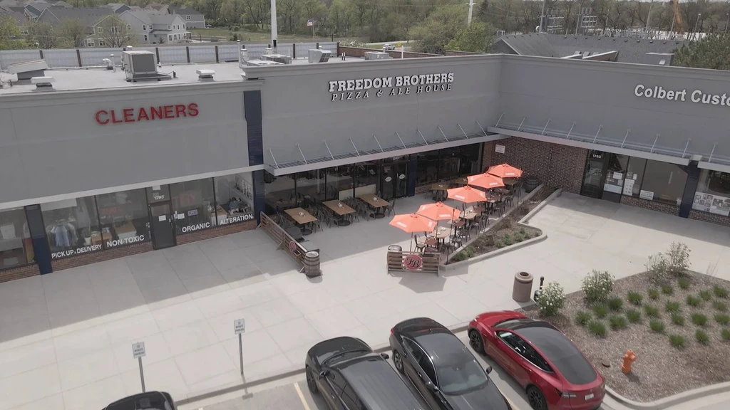 High-angle view of Freedom Brothers Pizza & Ale House with outdoor patio.