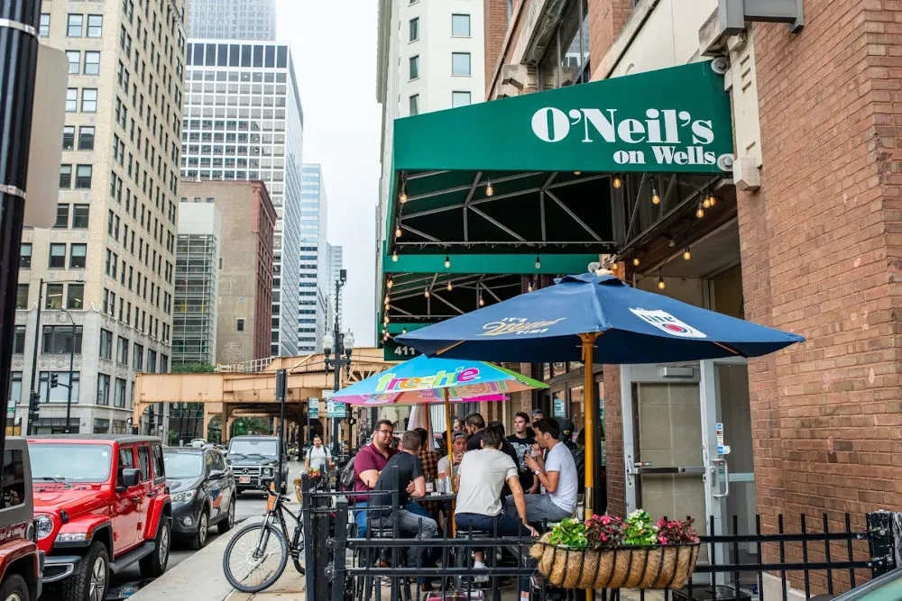 Exterior of O'Neil's on Wells with outdoor patio seating.