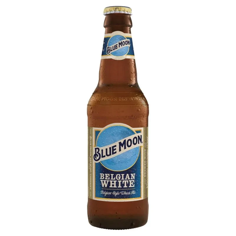 Blue Moon Belgian White beer bottle with condensation on white background.