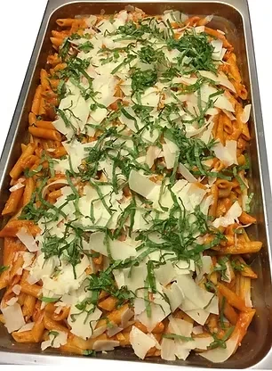 Pasta with reddish-orange sauce, white cheese, and green herbs.