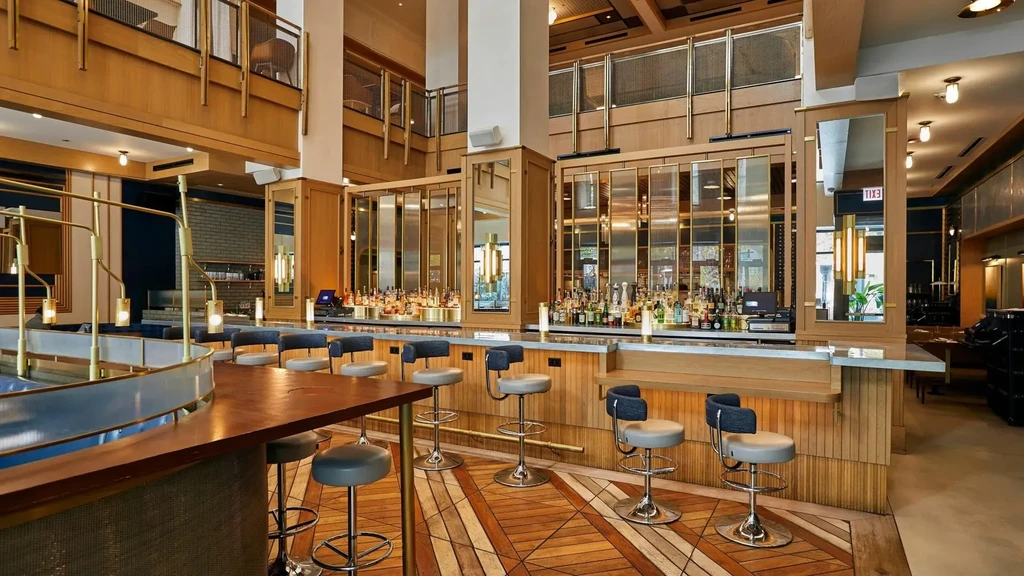 Upscale bar interior with well-stocked shelves and modern bar stools.
