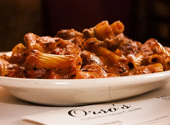 Rigatoni pasta in red sauce on a dish from Orso's.