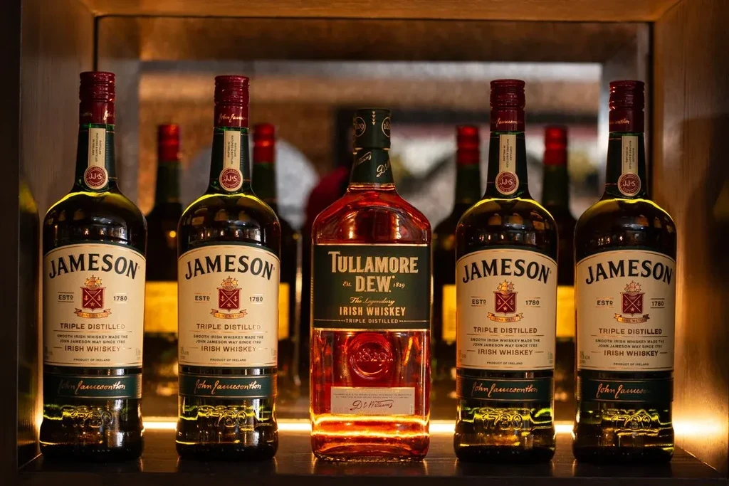 Five Irish whiskey bottles, including Jameson and Tullamore D.E.W.