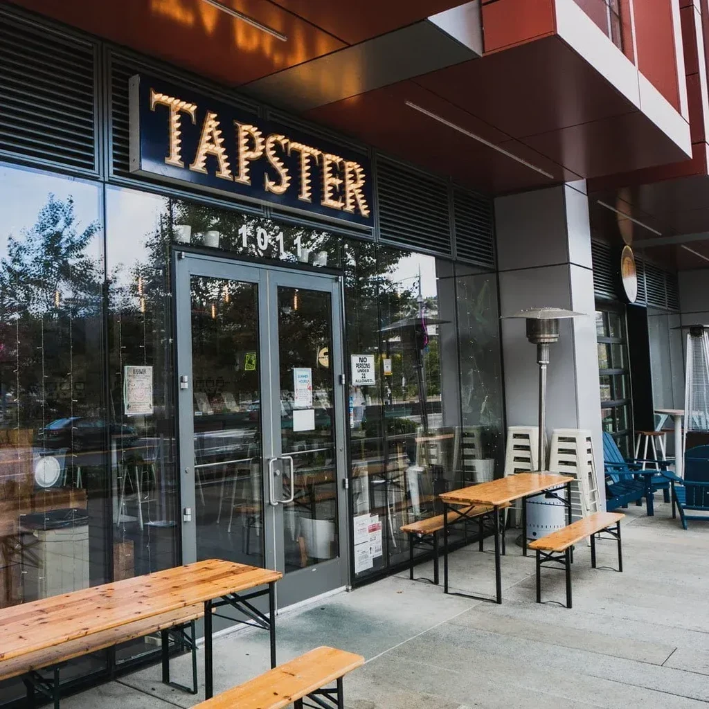 Exterior of Tapster restaurant with outdoor tables and seating.
