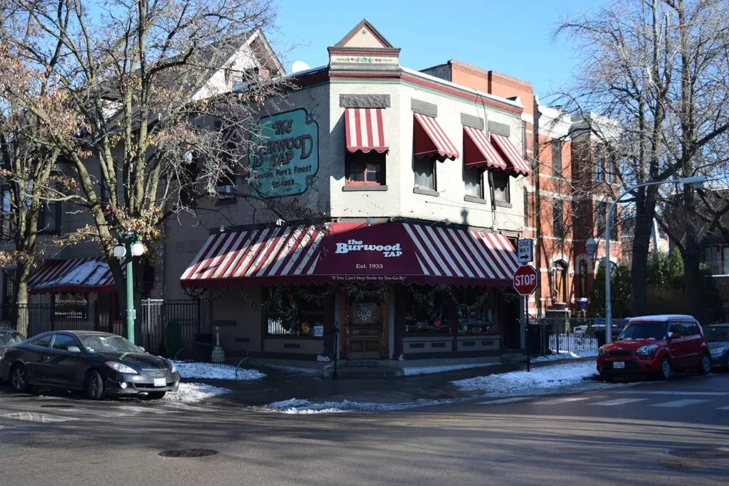 The Burwood Tap, a corner establishment with awnings, in the snow.