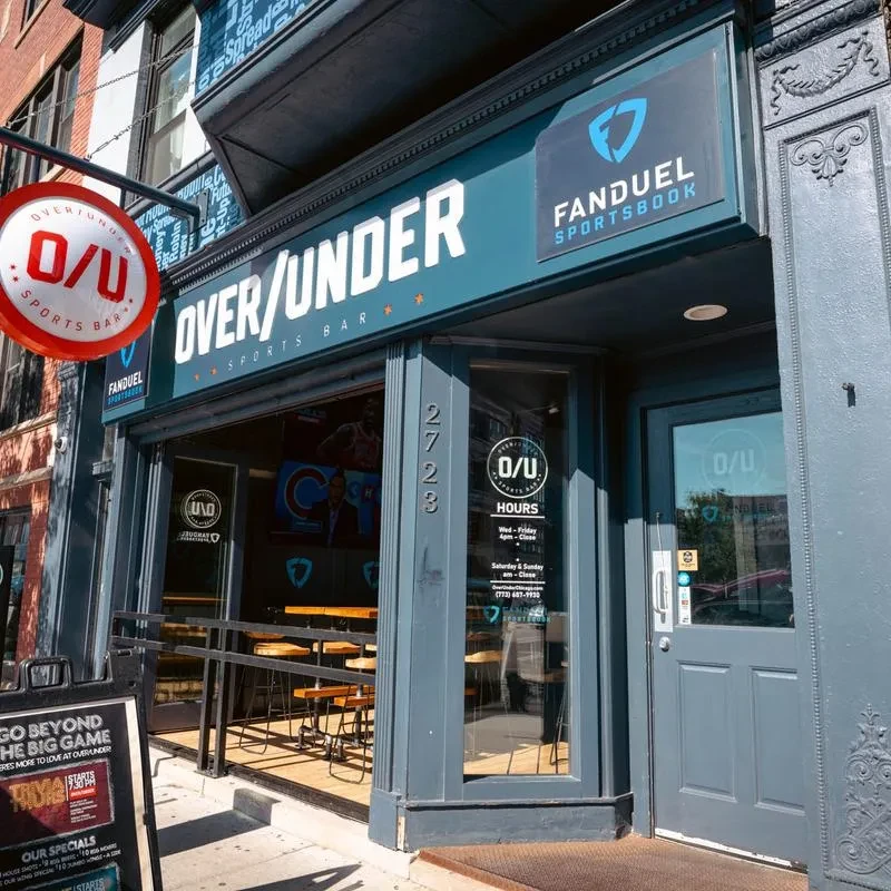 Exterior of Over/Under Sports Bar with a FanDuel Sportsbook sign.