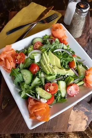 Overhead view of salad with smoked salmon, feta, and avocado.