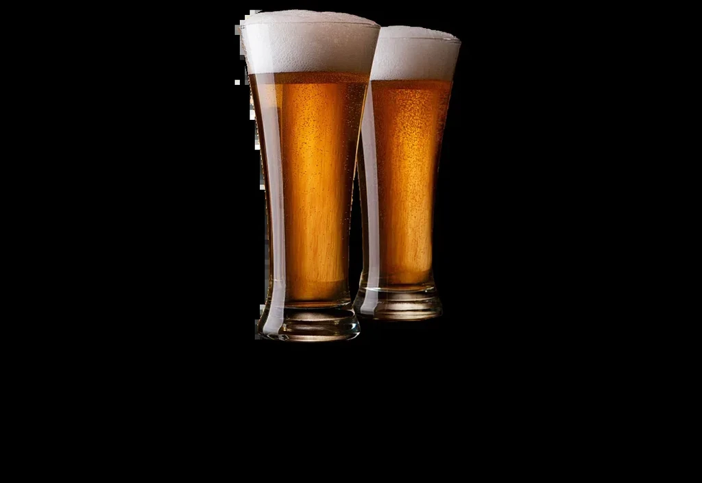 Two pilsner glasses filled with golden beer and white foam.