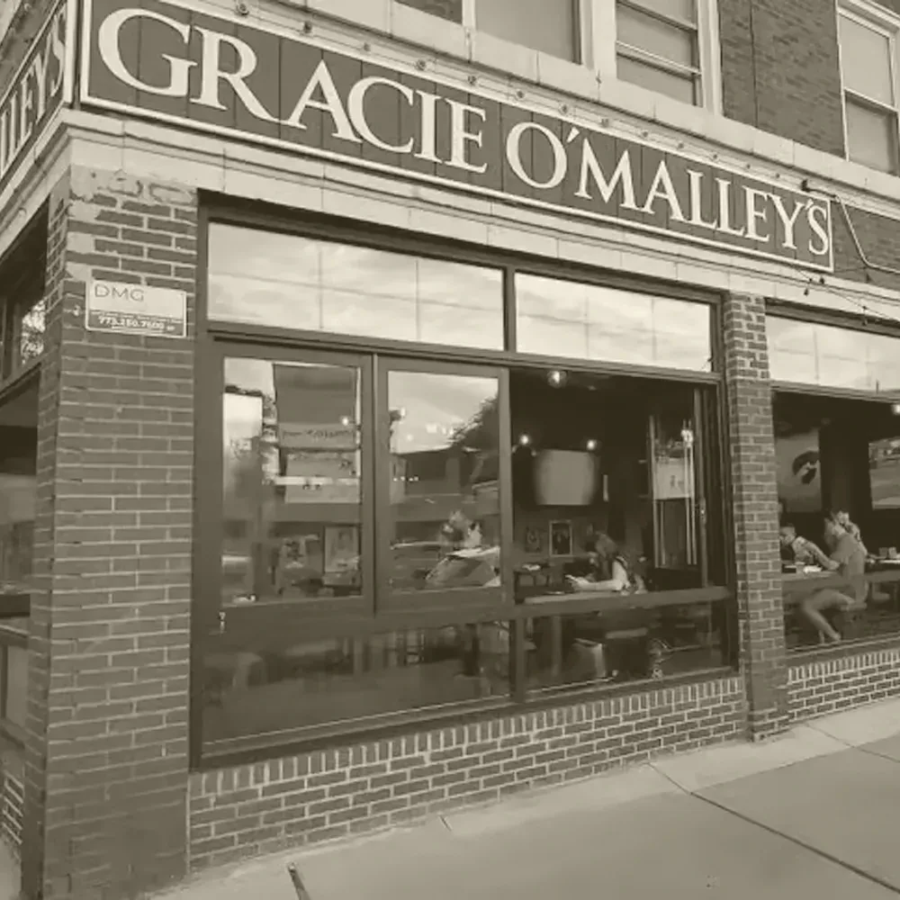 Exterior of Gracie O'Malley's, a brick restaurant with visible patrons.