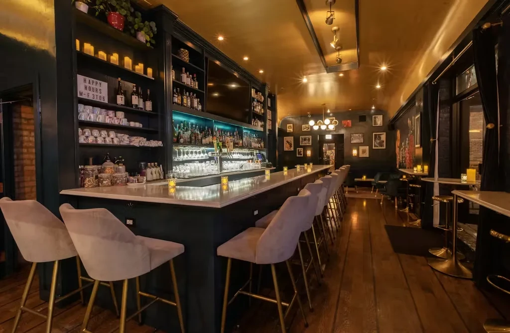 Stylish bar interior with a white marble counter and blue backlighting.