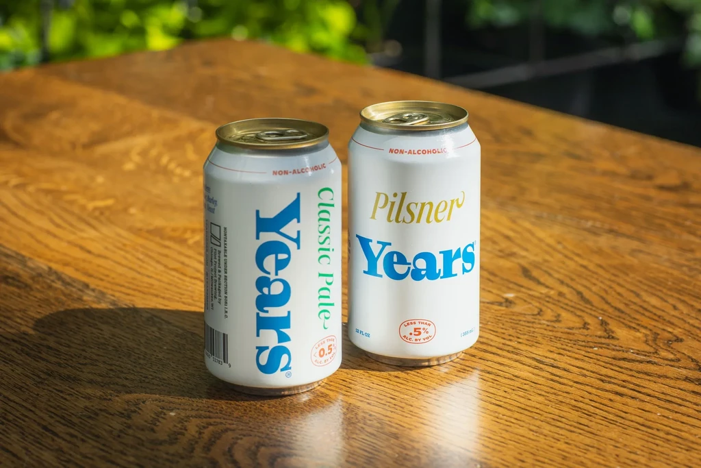 Two white aluminum cans of Years non-alcoholic beverages.