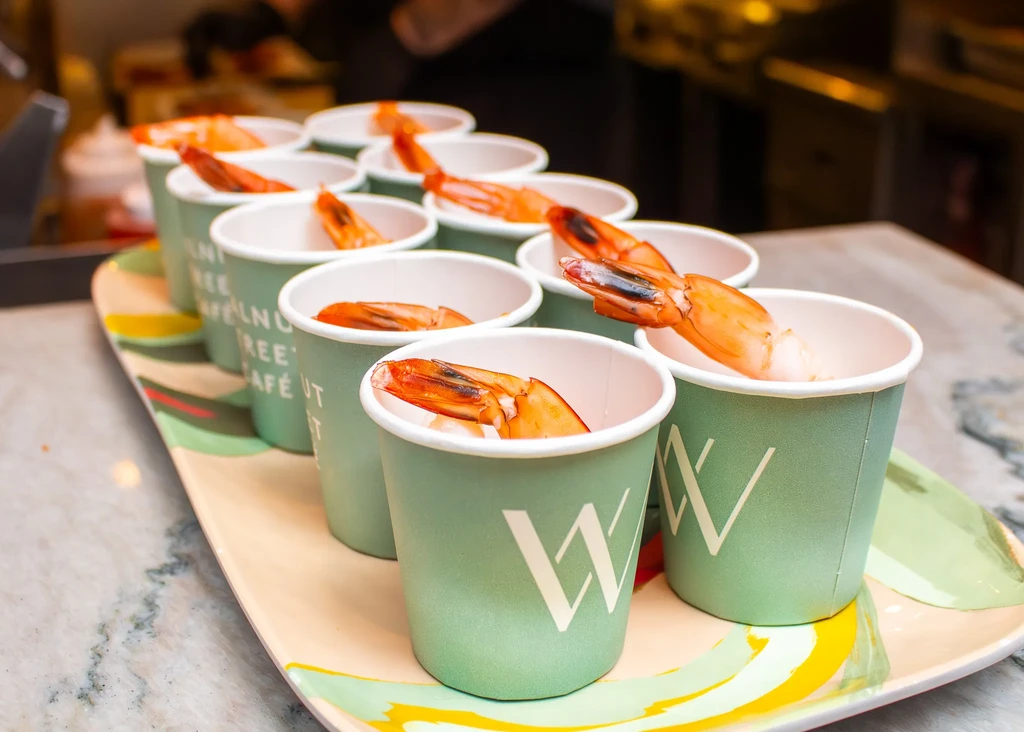 Walnut Tree Café cooked shrimp cocktails in green cups on a tray.