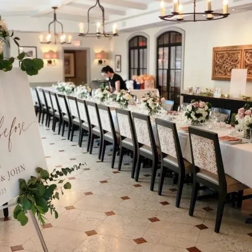 Elegant private dining room, long table set for a wedding.