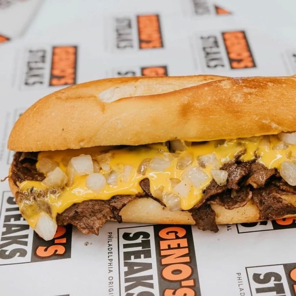 Geno's Steaks cheesesteak with chopped steak, melted cheese, onions.
