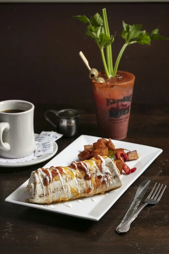 Burrito, roasted potatoes, coffee, and Klondike Mike's Bloody Mary.