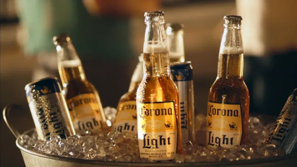 Prominent Corona Light bottle among others in a metal ice bucket.