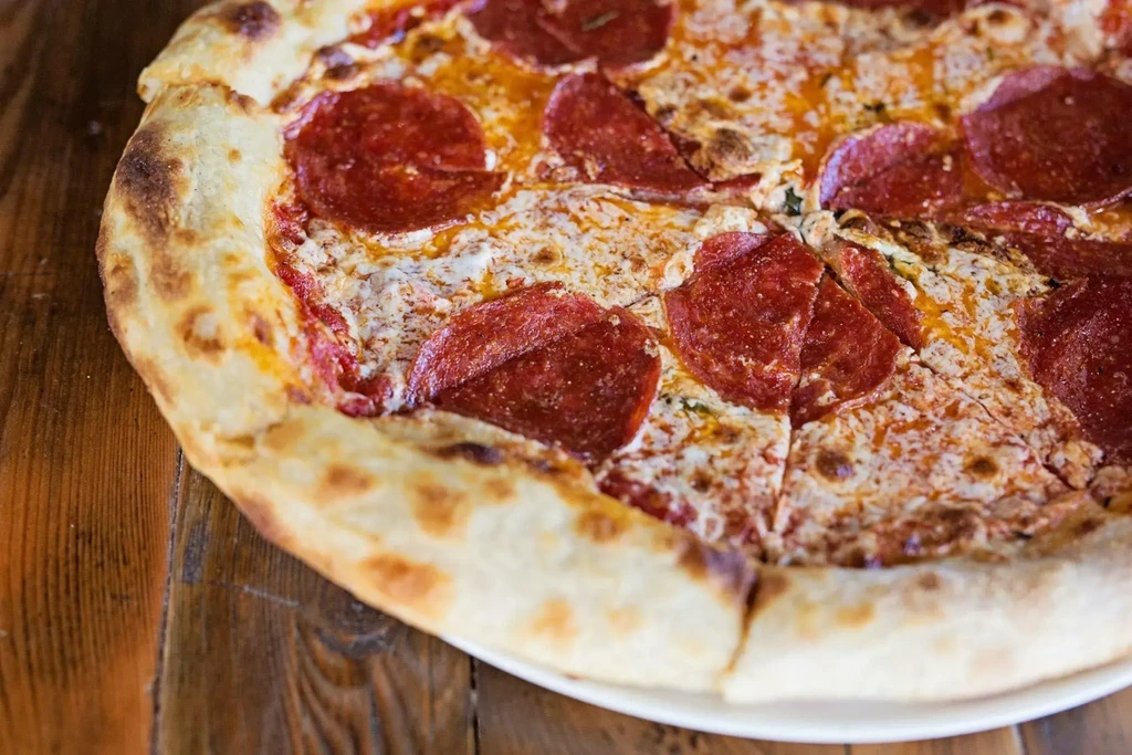 Freshly baked pepperoni pizza with golden crust and crispy pepperoni.