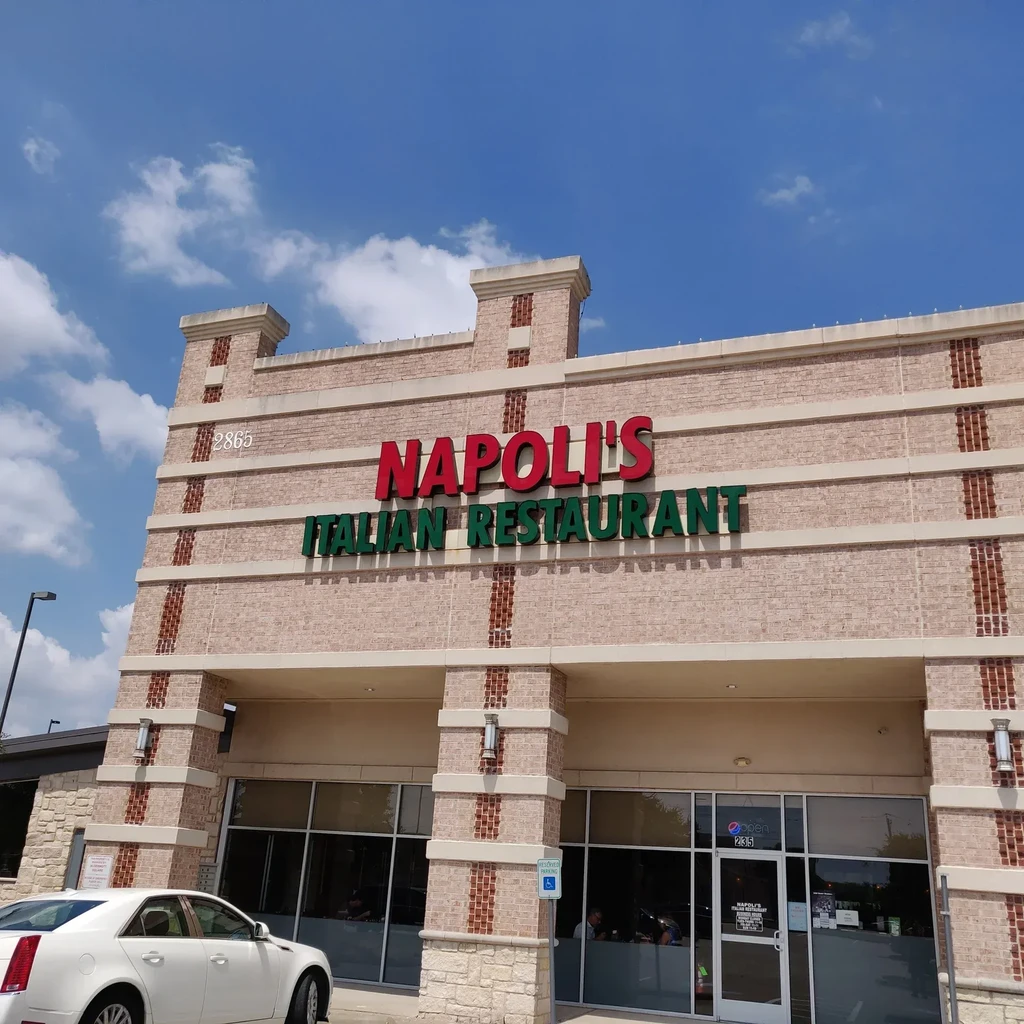 Exterior of Napoli's Italian Restaurant building on a sunny day.