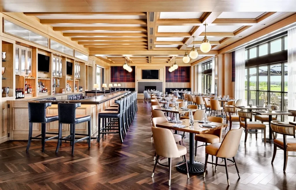 Elegant restaurant and bar with plaid walls and a scenic view.