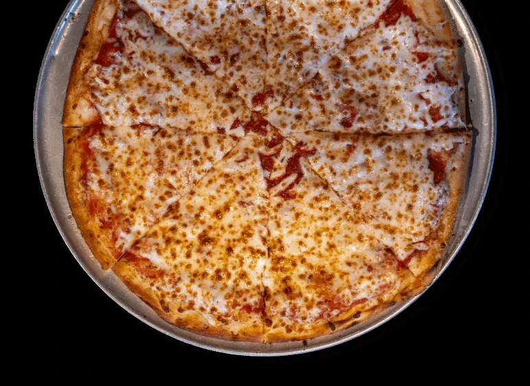 Freshly baked, sliced cheese pizza on a round metal pan.