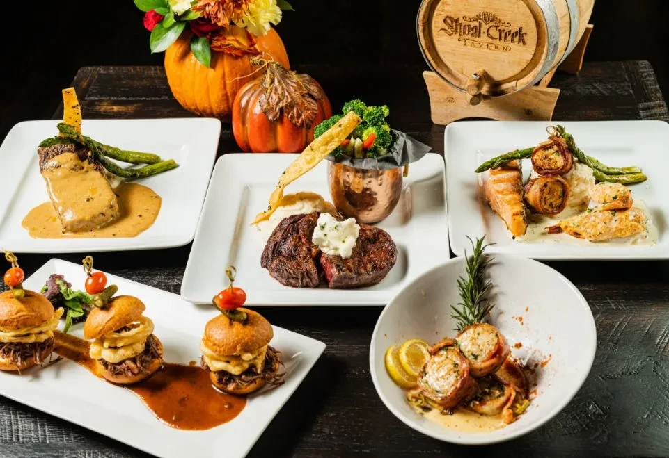 Professionally plated gourmet dishes with autumnal decor at Shoal Creek Tavern.