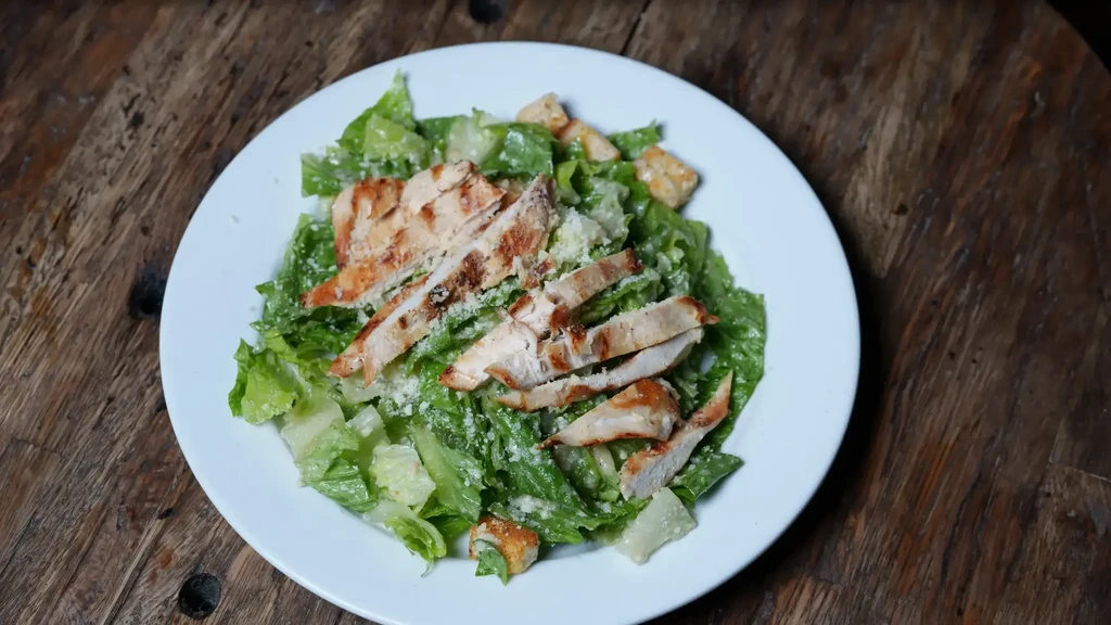 Grilled chicken Caesar salad with croutons and Parmesan.