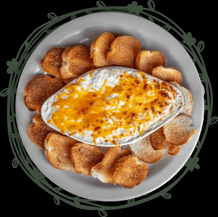 Baked cheese dip and toasted bread on a decorative white plate.