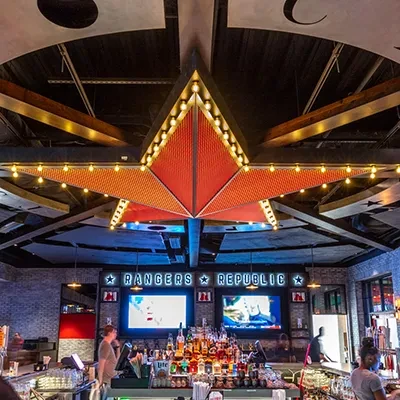 Rangers Republic bar interior with a large lit star and stocked counter.