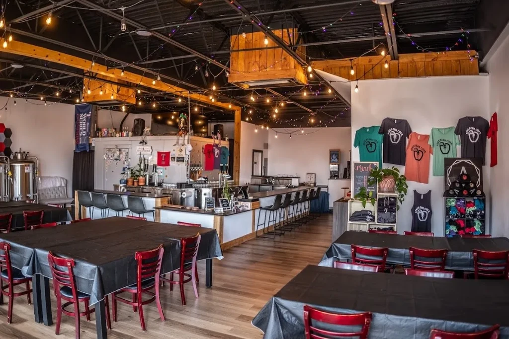 Interior of Abraxas Cider: dining area, bar, and brewing tanks.
