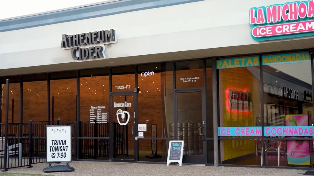 Atheneum Cider and La Michoacana Ice Cream storefronts in a strip mall.