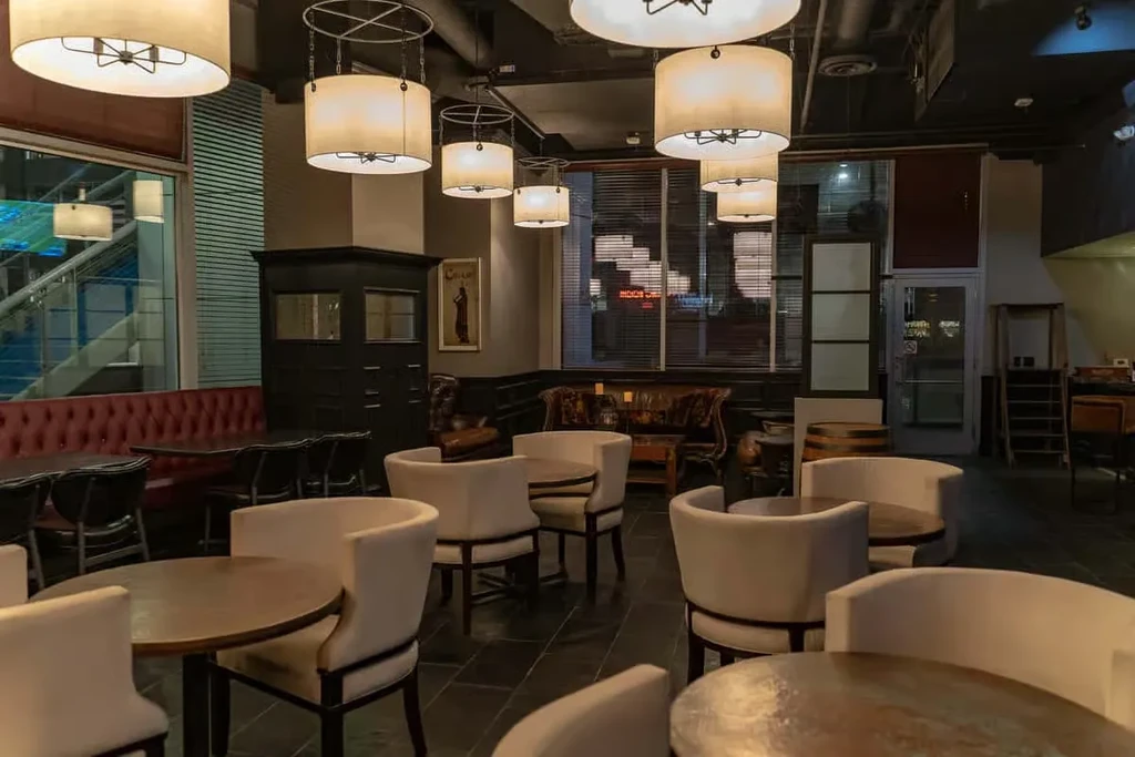 Empty sophisticated restaurant or lounge with varied seating and modern lighting.