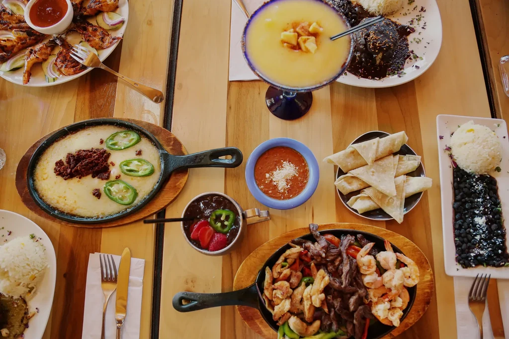 Overhead view: a diverse spread of Mexican food and drinks.