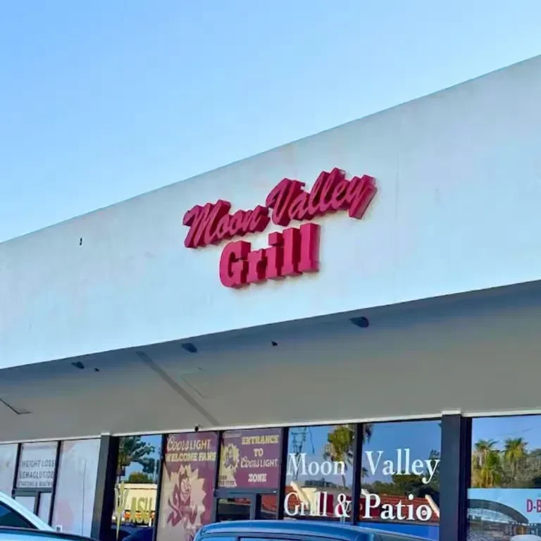 Exterior of Moon Valley Grill with signs for Semaglutide and Coors Light.
