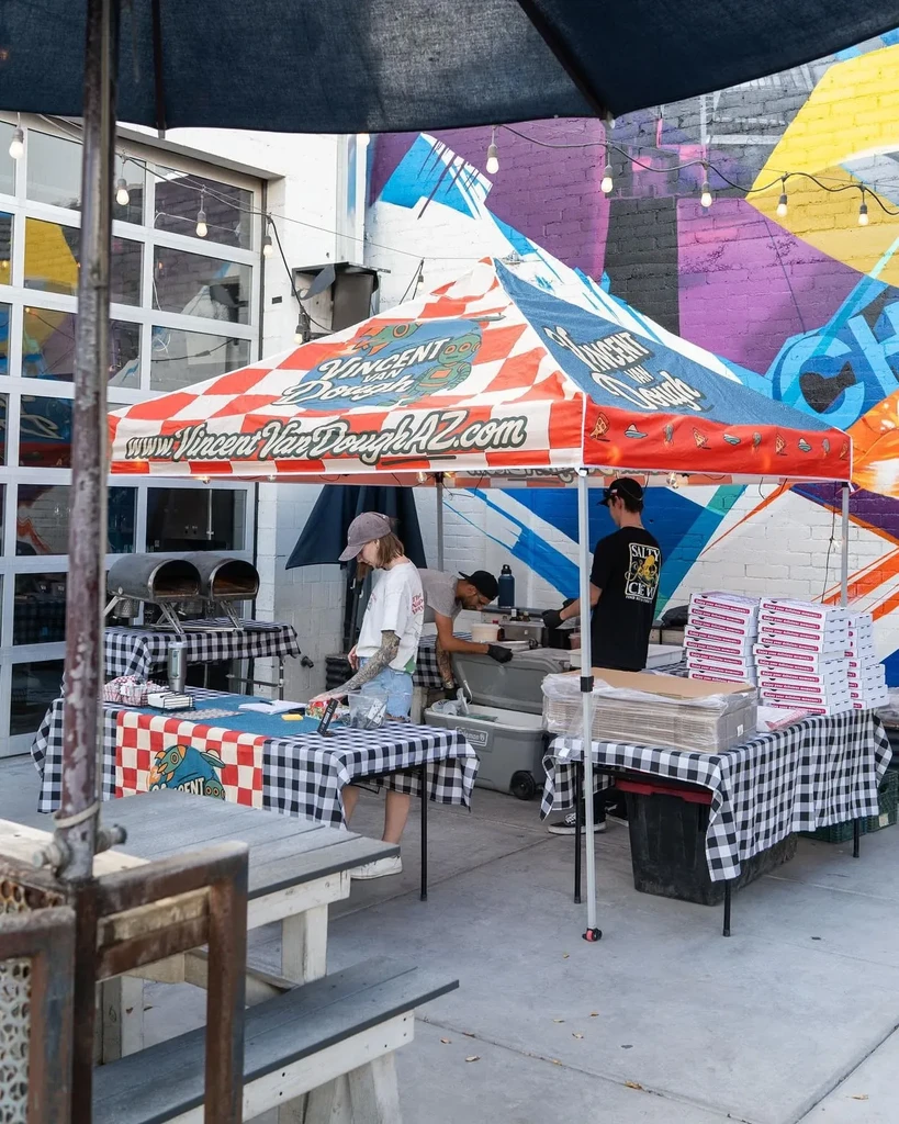 Vincent Van Dough AZ outdoor pizza stall with ovens, checkered tent.