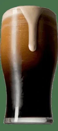Dark stout beer with a thick head and surging foam.
