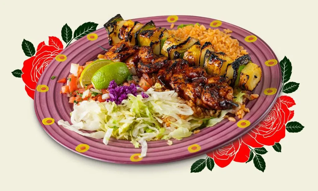 Grilled skewers, orange rice, salad, pico de gallo on purple plate.