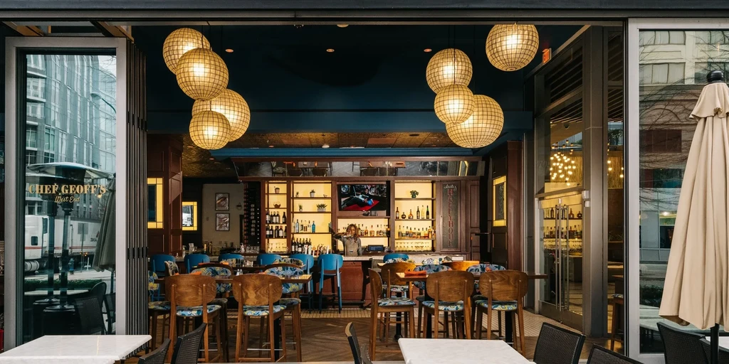 Modern interior of Chef Geoff's West End, with spherical hanging lights.