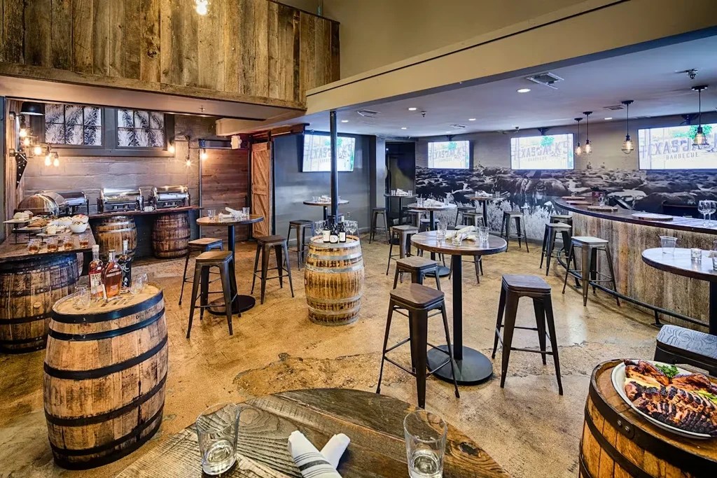 Rustic Texas Jack's Barbecue interior with cattle mural and food buffet.