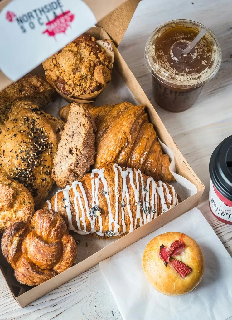 Overhead: assorted pastries and two Northside Social coffee drinks.
