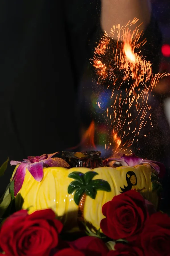 Yellow tiki bowl with flames and hand-created cascading sparks.