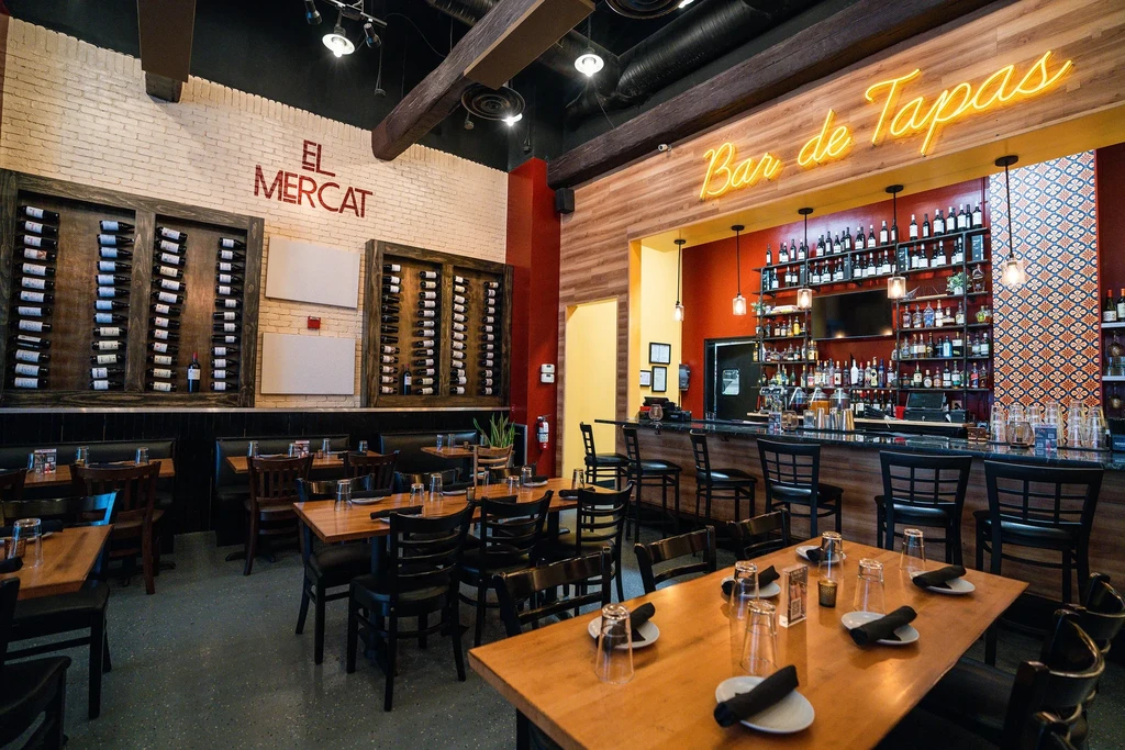 El Mercat restaurant interior featuring dining area and Bar de Tapas.