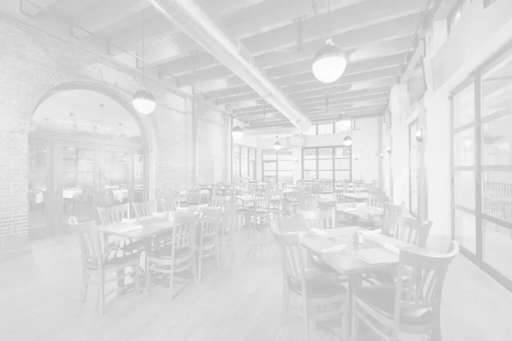 Bright, desaturated empty restaurant dining room, modern industrial design.