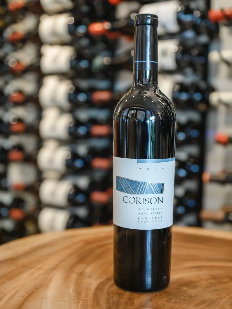 Corison Cabernet Sauvignon wine bottle displayed on a wooden surface.