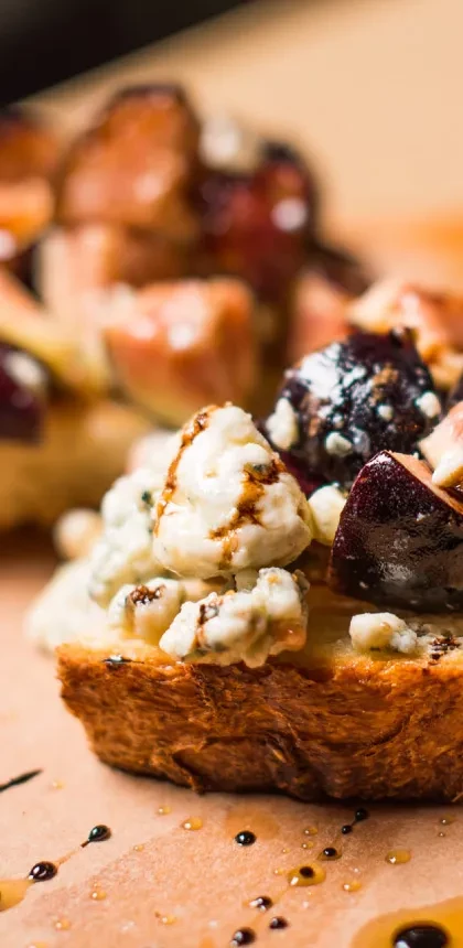 Toasted bread with blue cheese, fig, and balsamic glaze.