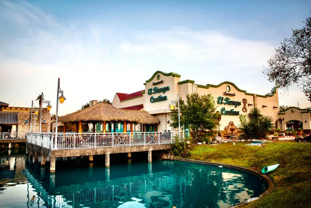 El Tiempo Cantina restaurant with outdoor dining over turquoise water.