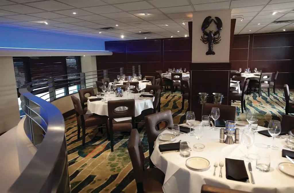 Spacious, well-lit restaurant dining area with tables set for service.