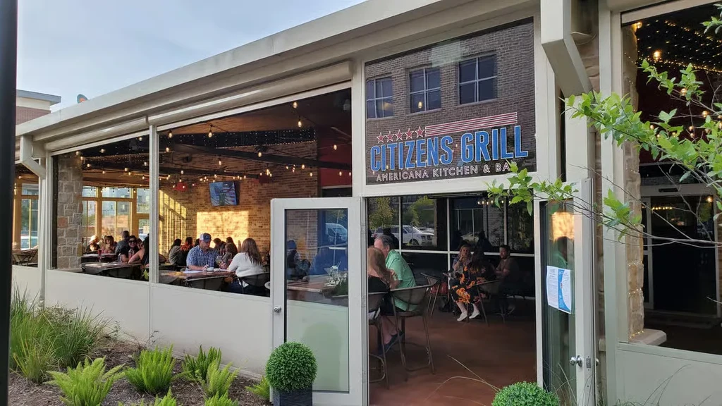 Citizens Grill restaurant, showing a busy patio and interior dining area.