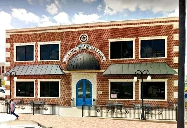 Exterior of a two-story brick building, the Lone Star Saloon.