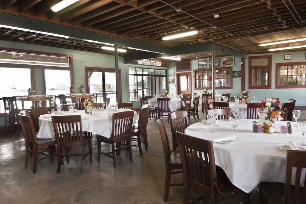 Empty Ursula M. Norton restaurant, Martha's Vineyard, with set tables.